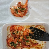 Tiger prawns baked in tomatoes and cheese